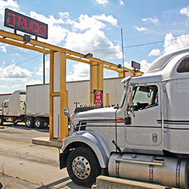 Photograph of a truck going through the Canadian border.