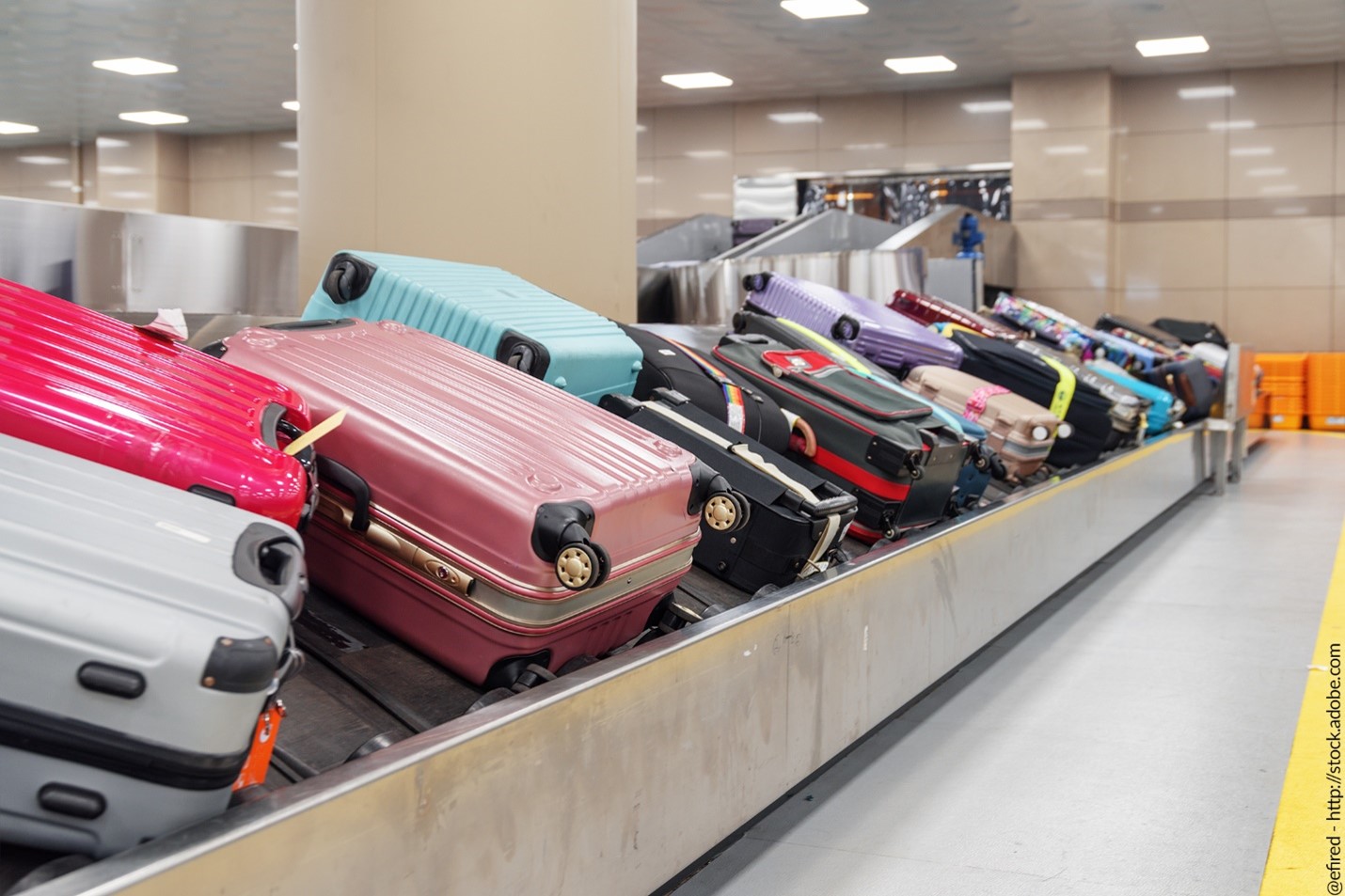 Picture of multiple suitcases on baggage carousel