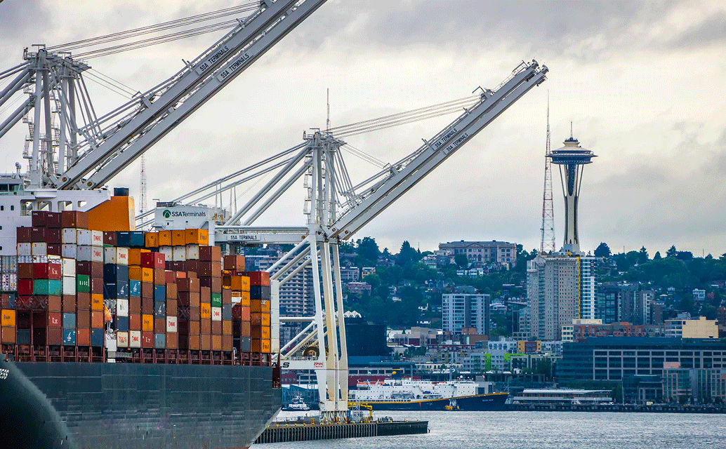 Image of a container ship in the port of Seattle, Washington, with the Space Needle in the background.