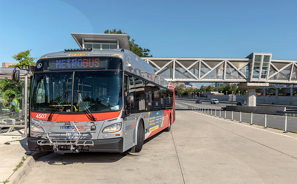 Image of a Metro bus at a bus station.
